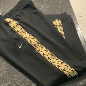 Women’s Nike sweatpants, black/gold, size large